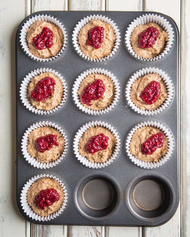 Raspberry Muffins - soft sweet almond muffins rippled with slightly tart home made raspberry and chia jam - simply delicious | thecookandhim.com