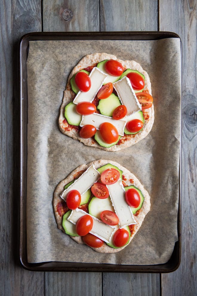 Vegan Pizza - exceptionally light pizza base topped with garlic, cherry tomatoes, garlic, basil and vegan camembert | thecookandhim.com