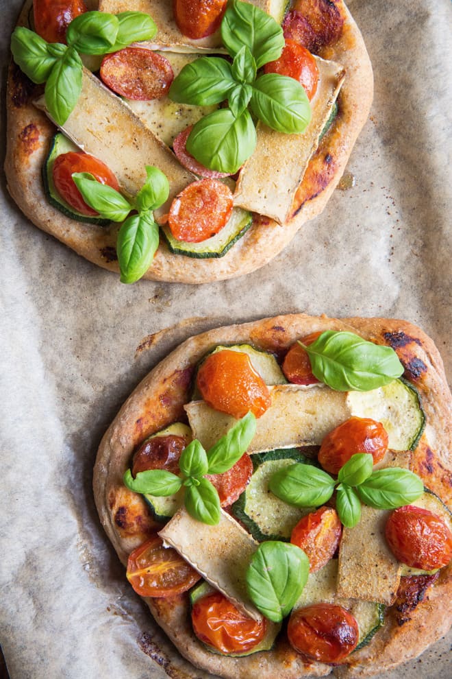 Vegan Pizza - exceptionally light pizza base topped with garlic, cherry tomatoes, garlic, basil and vegan camembert | thecookandhim.com