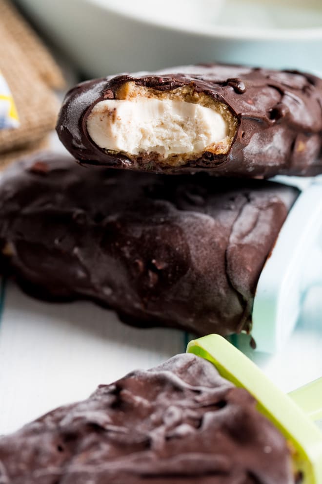 Chocolate Caramel Ice Cream Pops - vegan ice cream made with silky smooth cashews and coconut milk coated in a sticky date caramel all wrapped up in a superfood rich dark chocolate! #vegan #glutenfree #sugarfree #healthytreat #veganicecream | thecookandhim.com