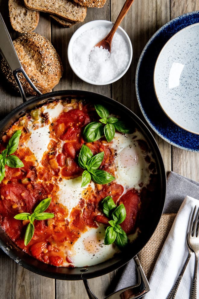 Fava Bean Shakshuka - a bright, lightly spiced hearty meal perfect for any time of the day! Full of tomatoes, herbs, garlic, peppers, onions and spices all made in just one pan! #vegetarian #meatfree #shakshuka | thecookandhim.com