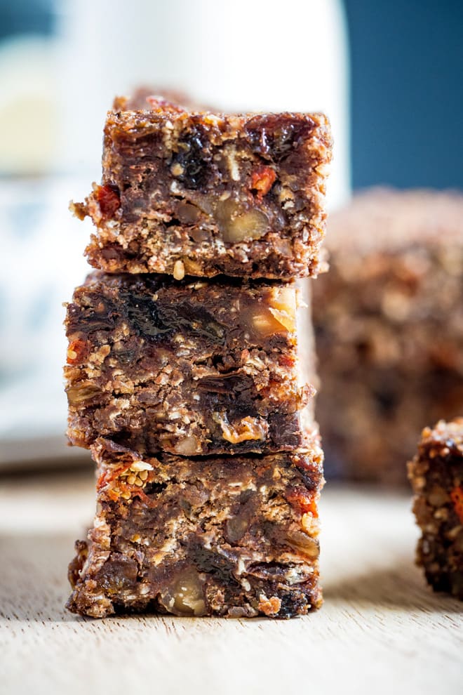 Healthy Vegan Granola Bars - based on Martha Stewart's recipe these bars aren't just healthy, they're also a little addictive!! Full of nuts, dried fruits, seeds and spices they're a perfect on the go treat! #vegan #granola #granolabars #healthytreat | Recipe on thecookandhim.com
