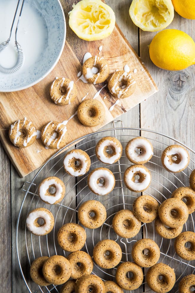Lemon and Poppy Seed Mini Donuts - Lusciously light, delicately lemony and oh so moreish! 10 minutes to make and 10 minutes to cook these things are dangerous! #vegan #donuts | thecookandhim.com