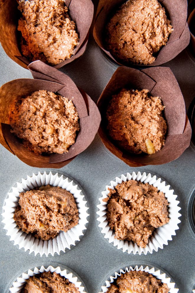 Orange Spiced Vegan Chocolate Muffins - these vegan muffins are soft and light yet rich and dark, full of orange, warming spices and divine dark chocolate. Super simple to make with two different topping options! Recipe on thecookandhim.com