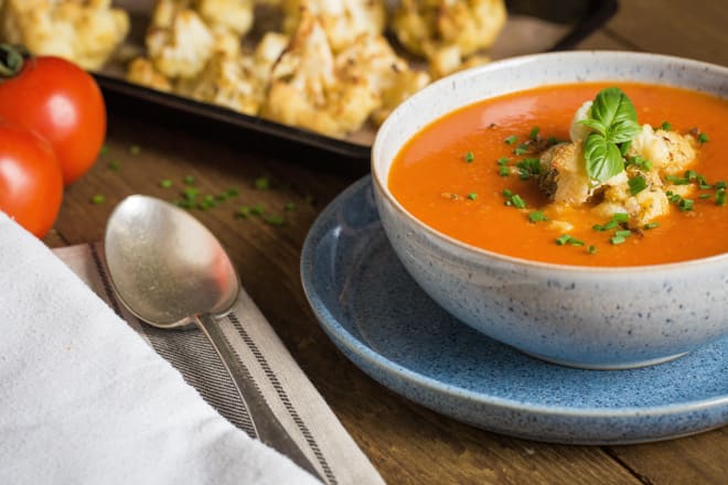 Red Pepper and Tomato Soup with Roasted Cauliflower - nothing but veggies, fruit (yep fruit!) and spices go into this deliciously rich and hearty soup that's so simple to make! Vegan and Gluten Free | thecookandhim.com