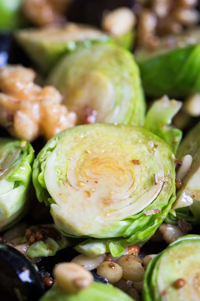 Roasted Sprouts, Grapes and Walnuts - super simple side to accompany so many things! Nutty sprouts, sweet grapes and crunchy walnuts and pinenuts with a dash of herbs, balsamic and mustard. Vegan and gluten free | thecookandhim.com