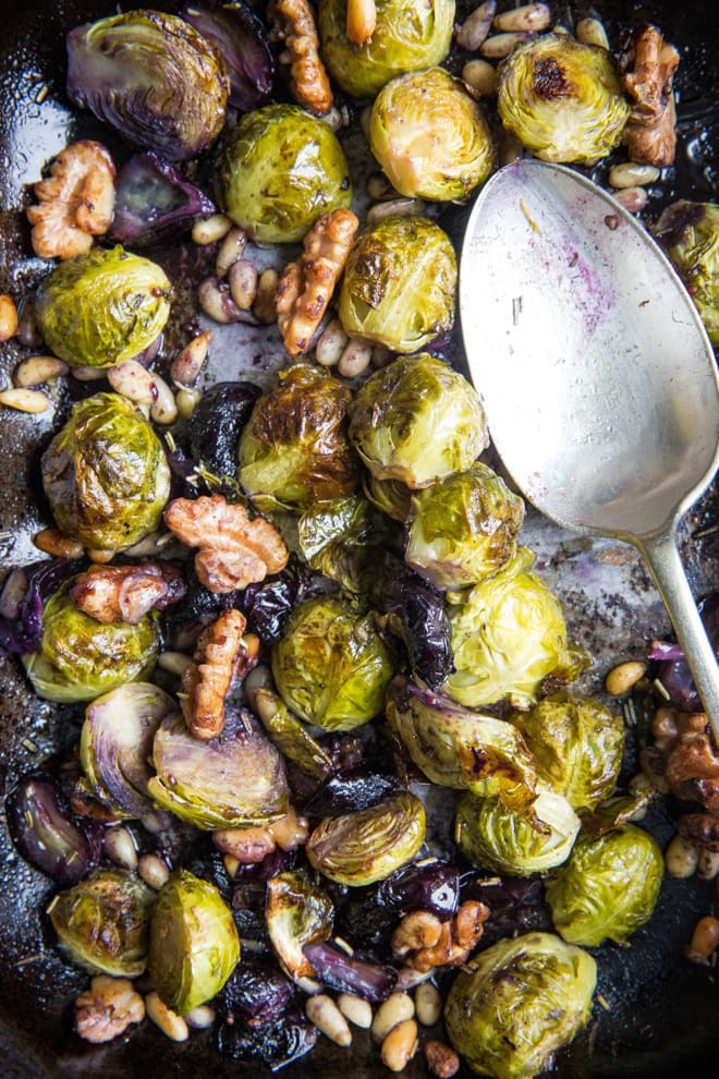 Roasted Sprouts, Grapes and Walnuts - super simple side to accompany so many things! Nutty sprouts, sweet grapes and crunchy walnuts and pinenuts with a dash of herbs, balsamic and mustard. Vegan and gluten free | thecookandhim.com
