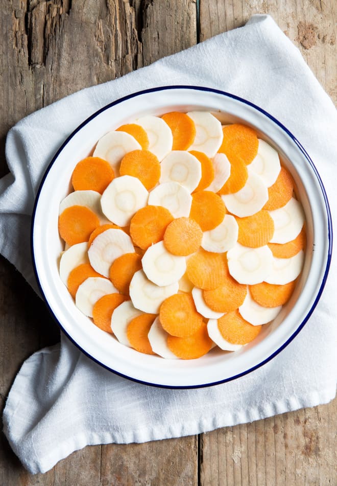 Root Vegetable Gratin - Layers of winter vegetables infused with garlic and thyme and slow baked to make them beautifully soft | thecookandhim.com