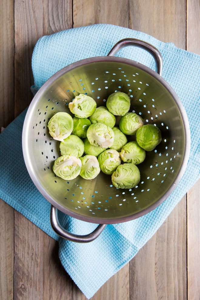 Sprouts with Walnuts and Shallots - fantastic holiday side dish for sprout lovers! Nuttied up with crunchy walnuts and lovely little camelina seeds from Hodmedods | thecookandhim.com