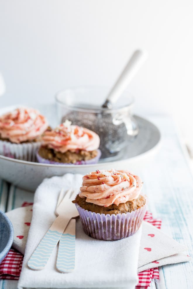 Strawberry Chia Muffins - Beautifully light, summery vegan muffins and frosting, both made with fresh strawberries! Hints of white chocolate make these an absolutely divine treat! Recipe on thecookandhim.com