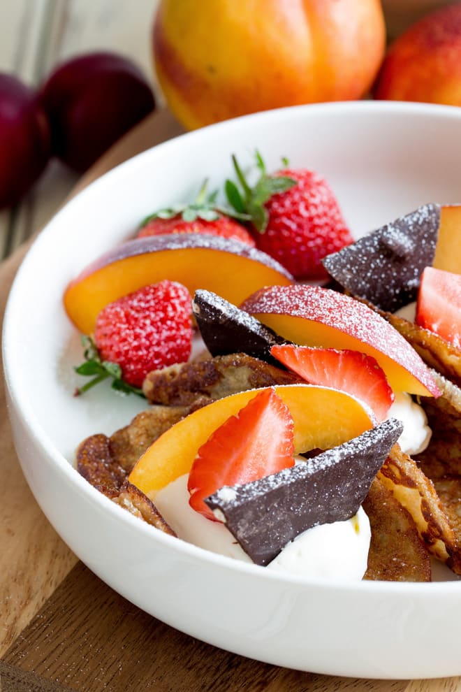 Summer Fruits Pancake Tacos - deliciously light vegan pancakes filled with smooth coconut cream and the best seasonal fruits. The chocolate is literally the icing on the pancake!! Recipe on thecookandhim.com