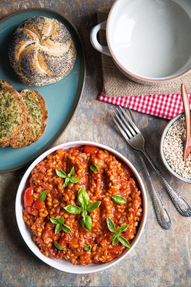 Tomato Pearl Barley Risotto - delicious one pan light but filling summer dish! Crammed with tomato flavour and 'hidden' veggies this is super easy comfort food. Vegan and gluten free. Recipe on thecookandhim.com