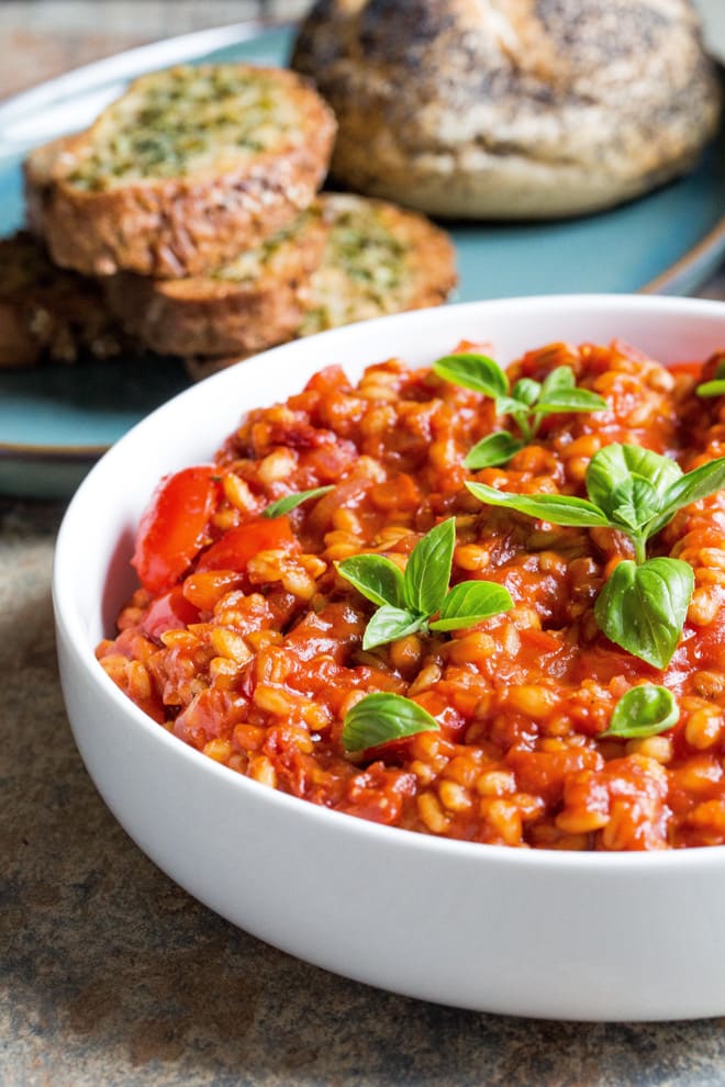 Tomato Pearl Barley Risotto - delicious one pan light but filling summer dish! Crammed with tomato flavour and 'hidden' veggies this is super easy comfort food. Vegan and gluten free. Recipe on thecookandhim.com