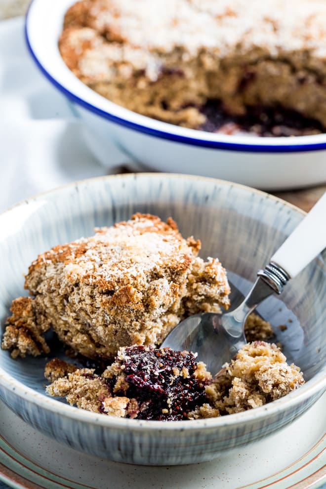 Blackberry Jam Coconut Pudding - Sticky, sweet homemade blackberry jam and soft, chewy, spongy, crumbly topping using coconut sugar, coconut flour and dessicated coconut | #vegan #veganbaking #glutenfree | Recipe on thecookandhim.com