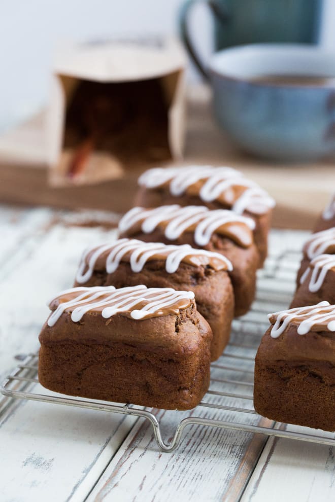 Cappuccino Mini Loaves - light and moist coffee sponge topped with a divinely sweet coffee and vanilla frosting. These vegan mini loaves are incredibly moreish! #vegan #veganbaking #coffeecake | Recipe on thecookandhim.com