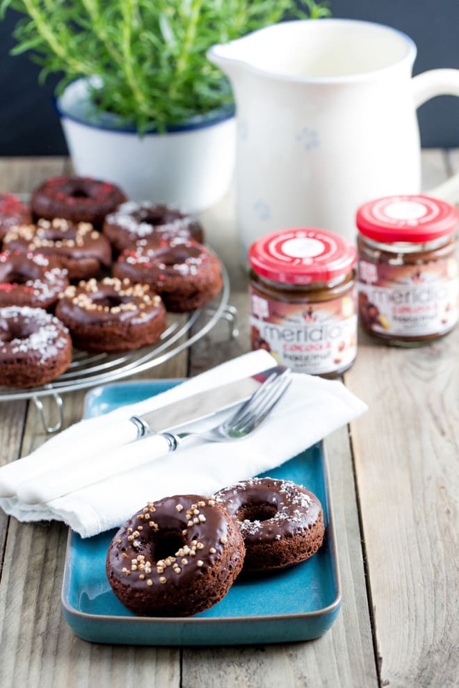 Chocolate Hazelnut Donuts - deliciously moist, light and fluffy baked donuts with smooth cocoa and hazelnut butter and a rich dark chocolate topping! #donuts #bakeddonuts #doughnuts | Recipe on thecookandhim.com