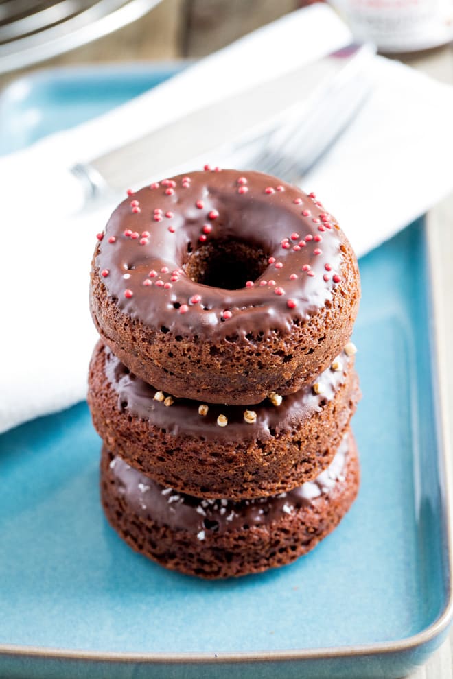 Chocolate Hazelnut Donuts - deliciously moist, light and fluffy baked donuts with smooth cocoa and hazelnut butter and a rich dark chocolate topping! #donuts #bakeddonuts #doughnuts | Recipe on thecookandhim.com