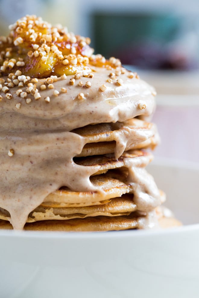 Coconut Vegan Pancakes - light, soft and fluffy vegan pancakes with a date, peanut butter and coconut milk drizzle! #veganpancakes #veganbreakfast | Recipe on thecookandhim.com