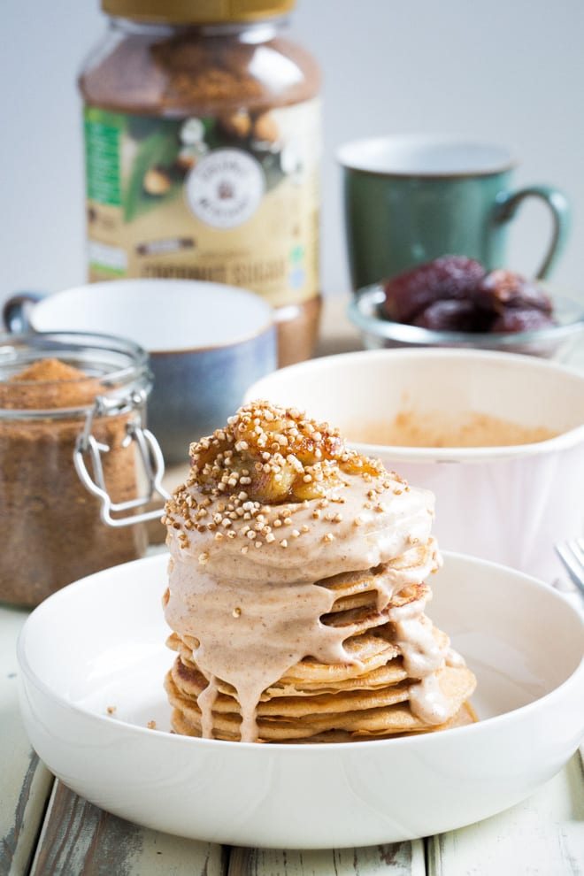 Coconut Vegan Pancakes - light, soft and fluffy vegan pancakes with a date, peanut butter and coconut milk drizzle! #veganpancakes #veganbreakfast | Recipe on thecookandhim.com