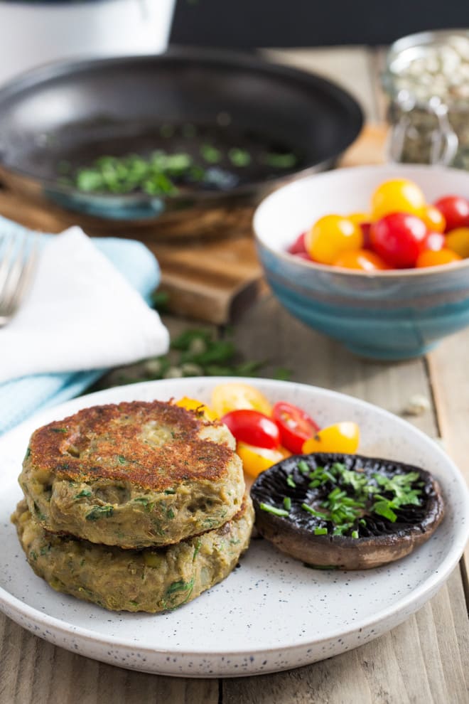 Mushy Pea Parsnip and Potato Cakes - These light and fluffy potato cakes are a great way to use up any leftover veg! With their crispy jackets they're also a super easy side dish, lunch or light light dinner! #vegan #mushypeas #potatocakes #veganmeal | Recipe on thecookandhim.com