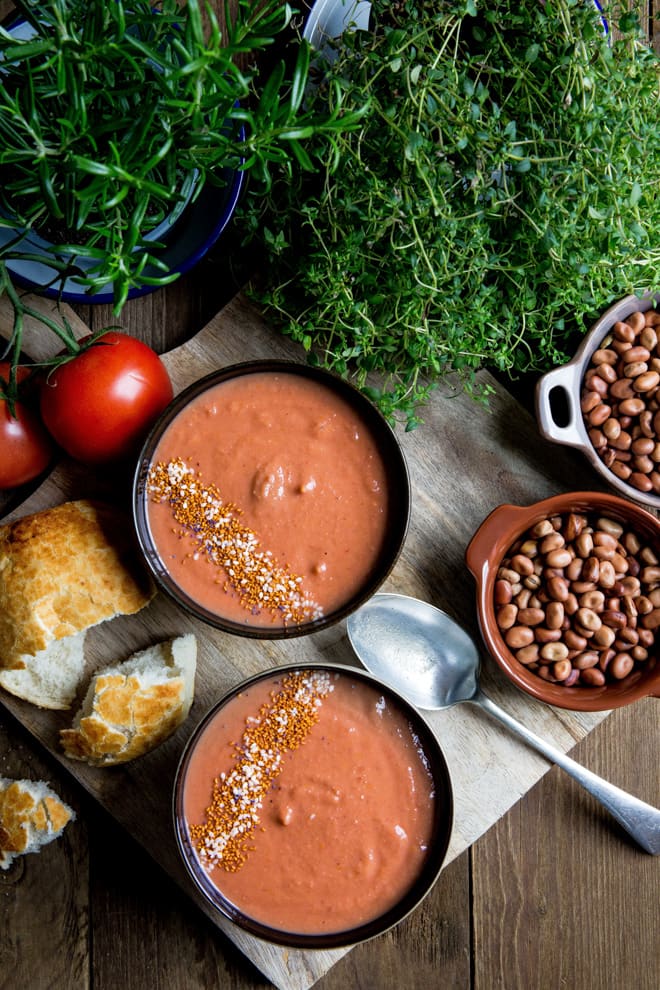 Roasted Garlic and Tomato Soup - aromatic and gently spiced soup, thickened with whole fava beans, finished with balsamic vinegar and coconut sugar to bring out real tomato flavour! #vegan #glutenfree #soup | Recipe on thecookandhim.com