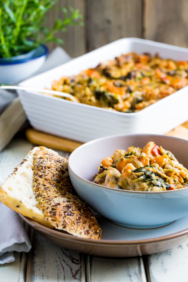 Vegan Cheesy Vegetable Bake - creamy, rich and full of seasonal vegetables and soft vegan cheese, this hearty vegetable bake makes a great side or main dish! #vegan #meatfree #vegancheese | Recipe on thecookandhim.com