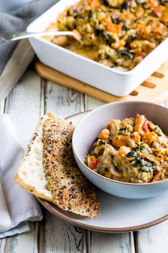 Vegan Cheesy Vegetable Bake - creamy, rich and full of seasonal vegetables and soft vegan cheese, this hearty vegetable bake makes a great side or main dish! #vegan #meatfree #vegancheese | Recipe on thecookandhim.com