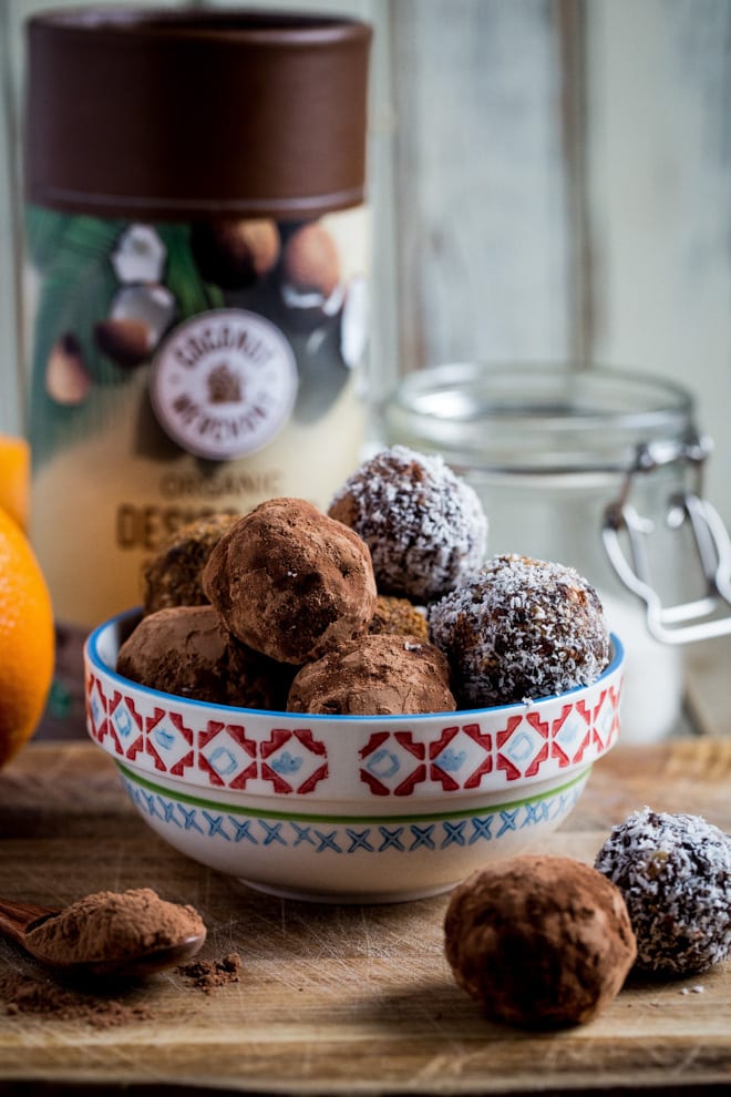 Christmas Spice Chocolate Truffles - these taste like tiny bites of Christmas cake .. with chocolate!! All natural sweetness with warming spices and zesty orange. These are sticky sweet Christmas heaven! #vegantreats #healthychristmas | Recipe on thecookandhim.com