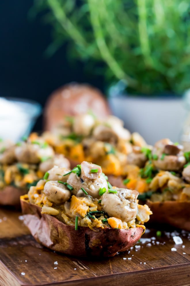 Garlic Mushroom Stuffed Sweet Potatoes - creamy fava beans, herbs, spices and aromatic garlic mushrooms are all crammed into crisp baked sweet jacket potatoes #meatfree #vegan #veganprotein | Recipe on thecookandhim.com