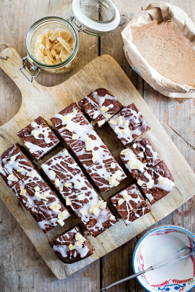 Ginger Cake - Light, moist vegan and gluten free sponge spiced with all the flavours of Christmas! Topped off with sticky sweet icing and crystalised ginger #vegan #vegancake #veganbaking #glutenfree | Recipe on thecookandhim.com