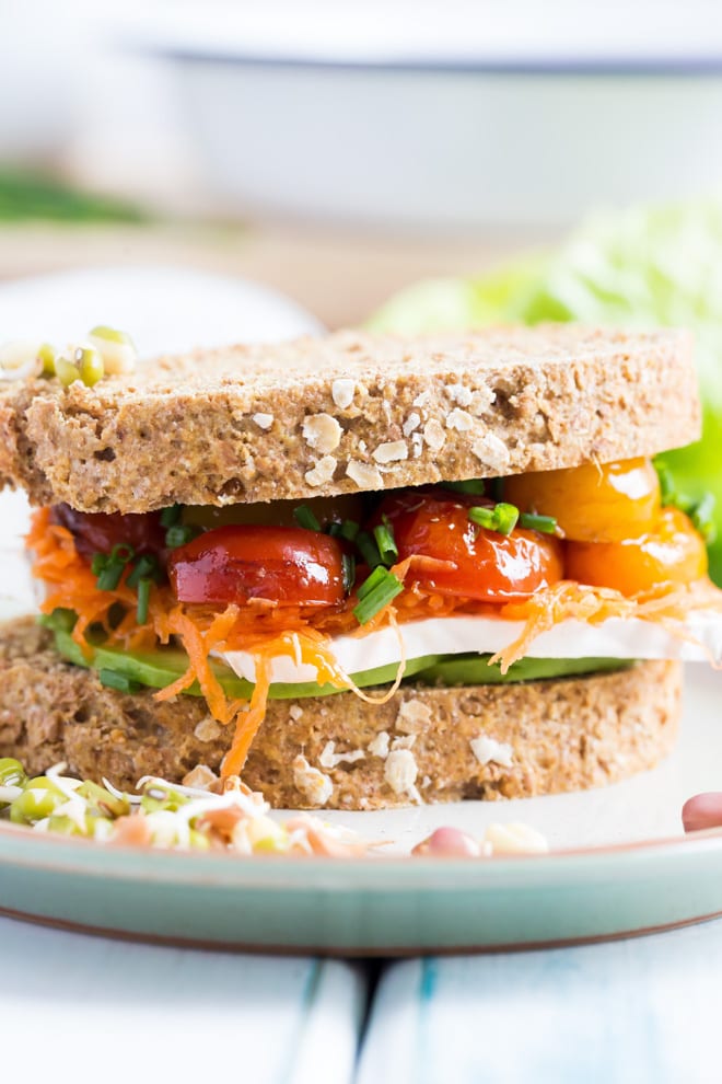 Ultimate Vegan Sandwich - Crusty homemade bread flavoured with kombucha and layers of filling with vegan cheese, roasted tomato, creamy avocado and crisp leaves make this the ultimate vegan sandwich #vegan #meatfree #sandwich | Recipe on thecookandhim.com