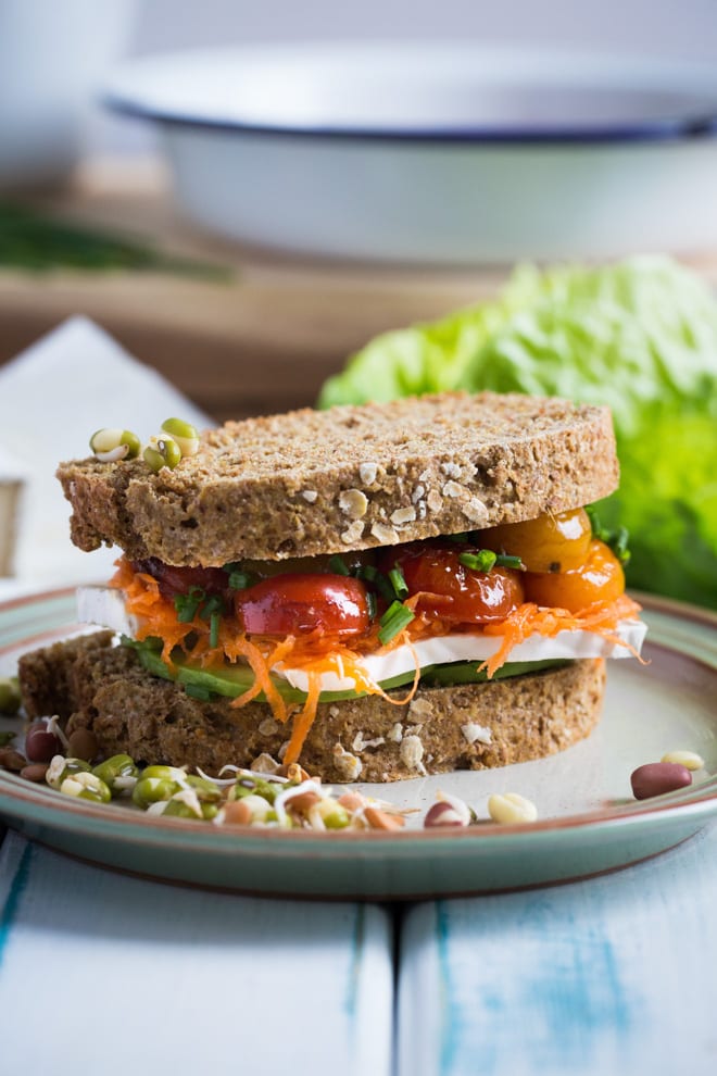 Ultimate Vegan Sandwich - Crusty homemade bread flavoured with kombucha and layers of filling with vegan cheese, roasted tomato, creamy avocado and crisp leaves make this the ultimate vegan sandwich #vegan #meatfree #sandwich | Recipe on thecookandhim.com