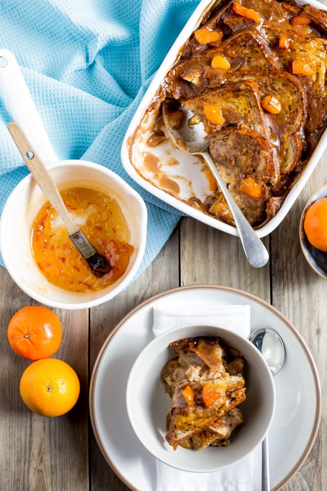 Vegan Bread and Butter Pudding - soft, seeded bread, chewy apricots and spiced vegan custard cooked to gooey perfection. All topped off with a tangy orange marmalade glaze! #veganbaking #vegandessert #vegantreats | Recipe on thecookandhim.com