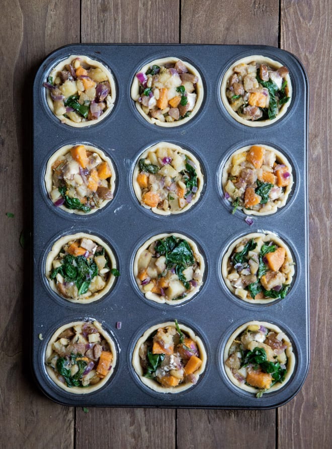 Vegan Christmas Pies - crisp pastry mini pies absolutely packed with seasonal veggies, herbs, chestnuts and vegan cheese #veganchristmas #veganrecipes | Recipe on thecookandhim.com