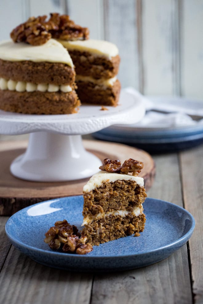 Carrot Cake - a delicate, perfectly spiced vegan sponge cake made with fresh grated carrot and finished with a sweet vegan frosting #vegancake #veganbaking #carrotcake #veganfrosting | Recipe on thecookandhim.com