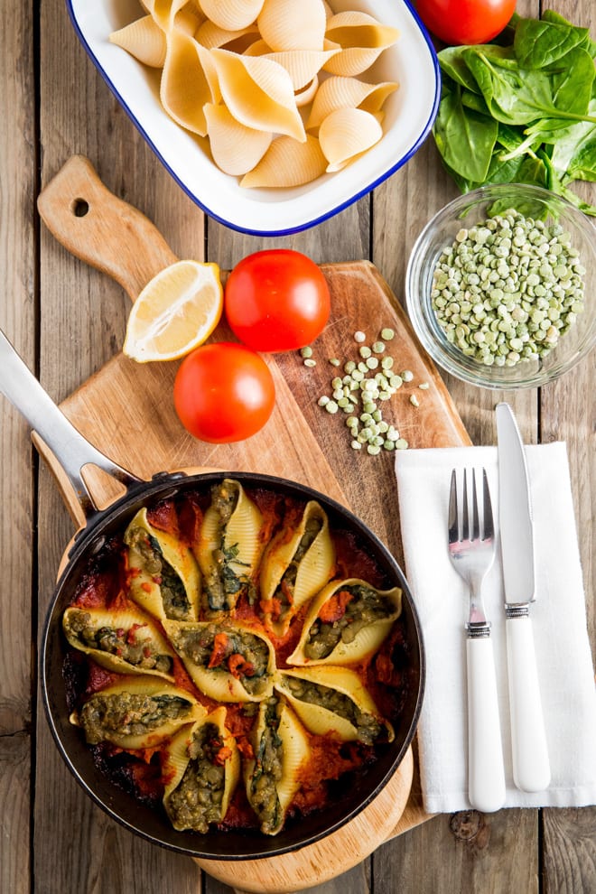 Green Split Pea and Pesto Stuffed Conchiglie - soft pasta shells filled with split peas and homemade pesto, baked in a tangy tomato sauce. All vegan and all delicious! #veganpastarecipe #veganrecipes #pastarecipes | Recipe on thecookandhim.com