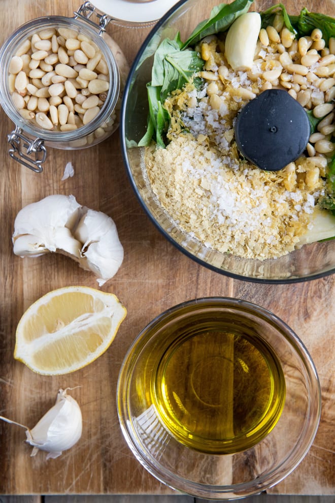 Green Split Pea and Pesto Stuffed Conchiglie - soft pasta shells filled with split peas and homemade pesto, baked in a tangy tomato sauce. All vegan and all delicious! #veganpastarecipe #veganrecipes #pastarecipes | Recipe on thecookandhim.com