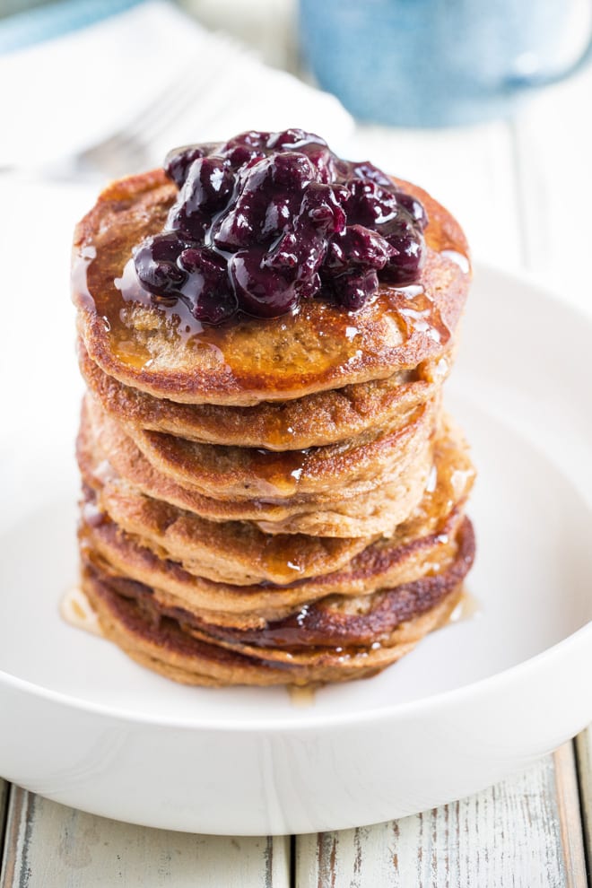 Vegan Pancakes Recipe - light, fluffy and easy vegan pancakes made without milk or eggs. The perfect weekend breakfast! #veganpancakes #veganpancakerecipe #easyveganpancakes | Recipe on thecookandhim.com