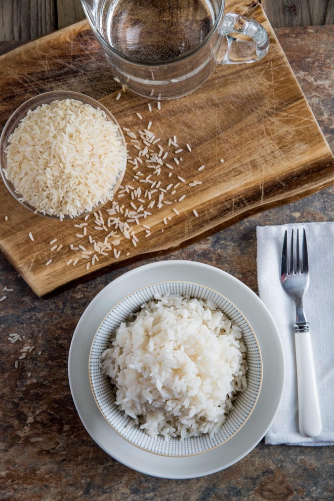 The Ultimate Guide: How to Cook Rice - a foolproof step by step guide for perfectly fluffy white rice every time! Recipe and guide on thecookandhim.com
