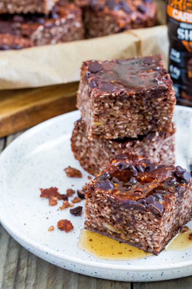 Chocolate Protein Baked Oatmeal - triple chocolate fudgy baked oatmeal with protein shake, protein spread and protein powder! The perfect post work out treat! #bakedoats #proteinbreakfast | Recipe on thecookandhim.com