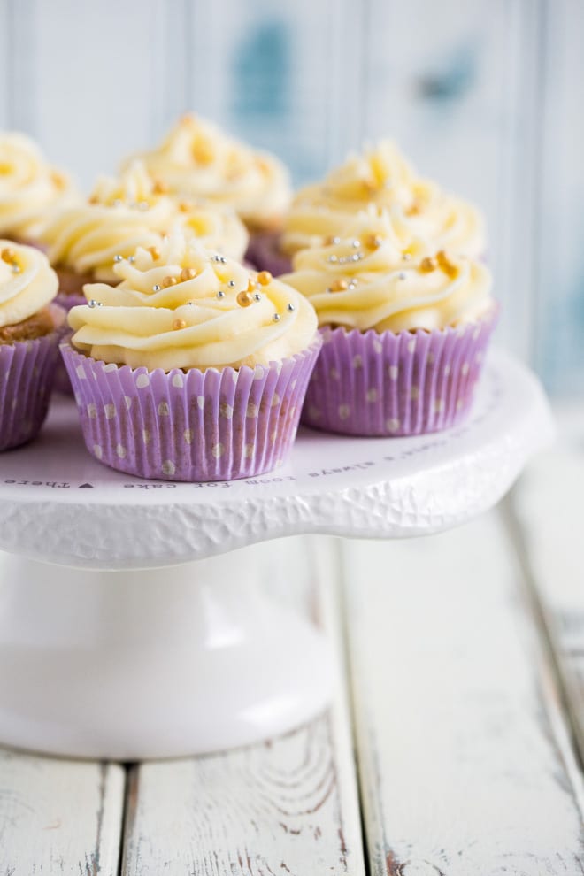 Easy Vegan Vanilla Cupcakes - just a few, basic ingredients needed for these delicate little sponges topped with sweet and creamy vegan frosting! #vegancupcakes #veganbaking #veganfrosting #vanillacupakes | Recipe on thecookandhim.com