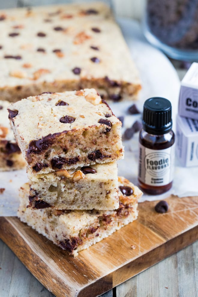 Cookies and Cream Vegan Blondies - delicately light vegan sponge filled with walnuts, chocolate chips and Cookies and Cream natural flavouring - these things are dangerously moreish!! #veganbaking #veganblondies #veganrecipes | Recipe on thecookandhim.com