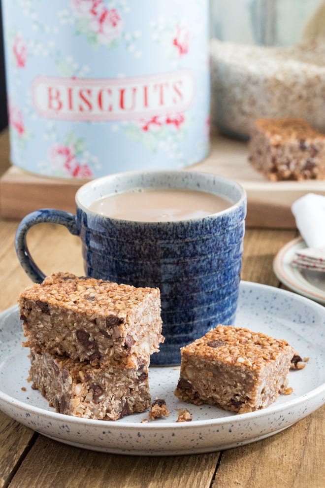 Chocolate Peanut Butter Flapjacks - sticky, chewy, nutty, chocolatey perfection! Sweetened with dates and agave syrup these are a great grab and go breakfast or a delicious afternoon treat! #veganrecipes #veganbaking #veganbreakfast #healthytreat | Recipe on thecookandhim.com