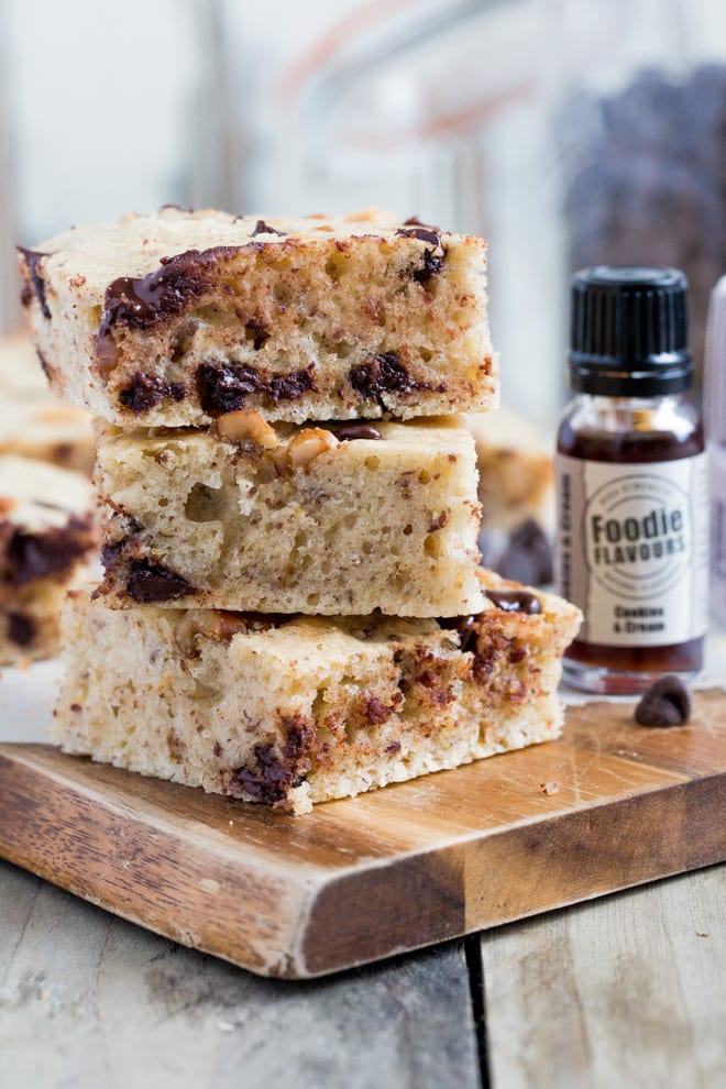 Cookies and Cream Vegan Blondies - delicately light vegan sponge filled with walnuts, chocolate chips and Cookies and Cream natural flavouring - these things are dangerously moreish!! #veganbaking #veganblondies #veganrecipes | Recipe on thecookandhim.com