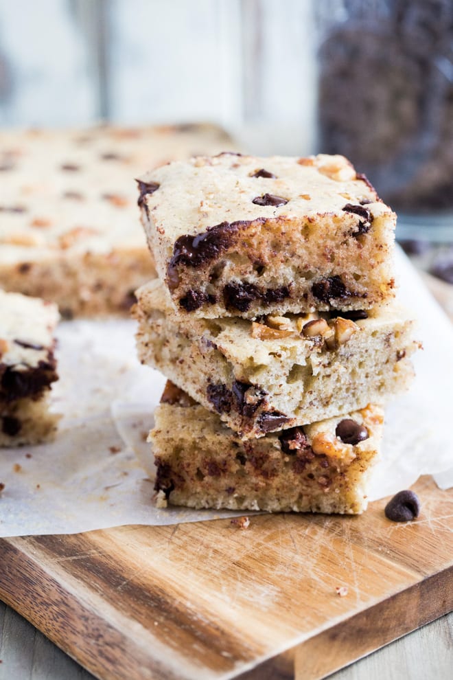 Cookies and Cream Vegan Blondies - delicately light vegan sponge filled with walnuts, chocolate chips and Cookies and Cream natural flavouring - these things are dangerously moreish!! #veganbaking #veganblondies #veganrecipes | Recipe on thecookandhim.com