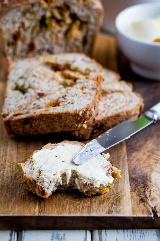 Asparagus and Sun Dried Tomato Bread - all the flavours of spring in every bite, along with tangy tomatoes, melty vegan cheese and aromatic basil! #veganbaking #homemadebread #veganrecipes #asparagus | Recipe on thecookandhim.com