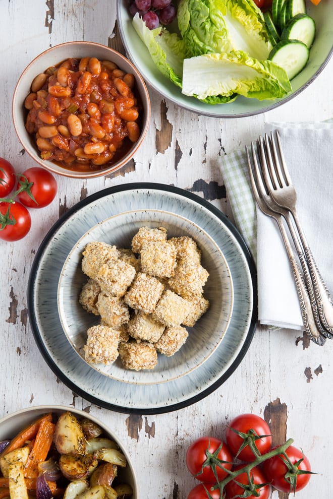 Marinated tofu baked with a deliciously crunchy breadcrumb crust and baked to crispy perfection! #tofu #tofurecipes #howcocooktofu #tofumarinade | Recipe on thecookandhim.com