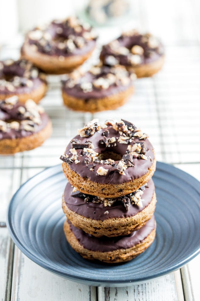 Go Nuts Donuts - Baked vegan donuts dipped in chocolate, topped with crumbled Grenade Go Nuts bars - full of vegan protein and delicious rich flavours! #vegandonuts #veganbaking #veganrecipes #veganprotein | Recipe on thecookandhim.com