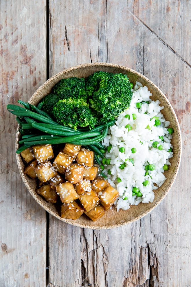 Teriyaki Baked Tofu - better than takeout but easy and quick enough for a weeknight meal, this crispy teriyaki baked tofu is a little bit sweet, a little bit savoury and so delicious! #teriyaki #bakedtofu #tofu #veganmeals | Recipe on thecookandhim.com
