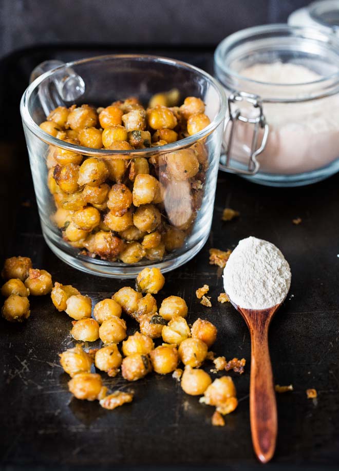 Crisp and garlicky these paremsan roasted chickpeas are perfect as nibbles or sprinkled in a salad for extra flavourful crunch! #chickpeas #chickpearecipes #healthysnack #roastedchickpeas | Recipe on thecookandhim.com